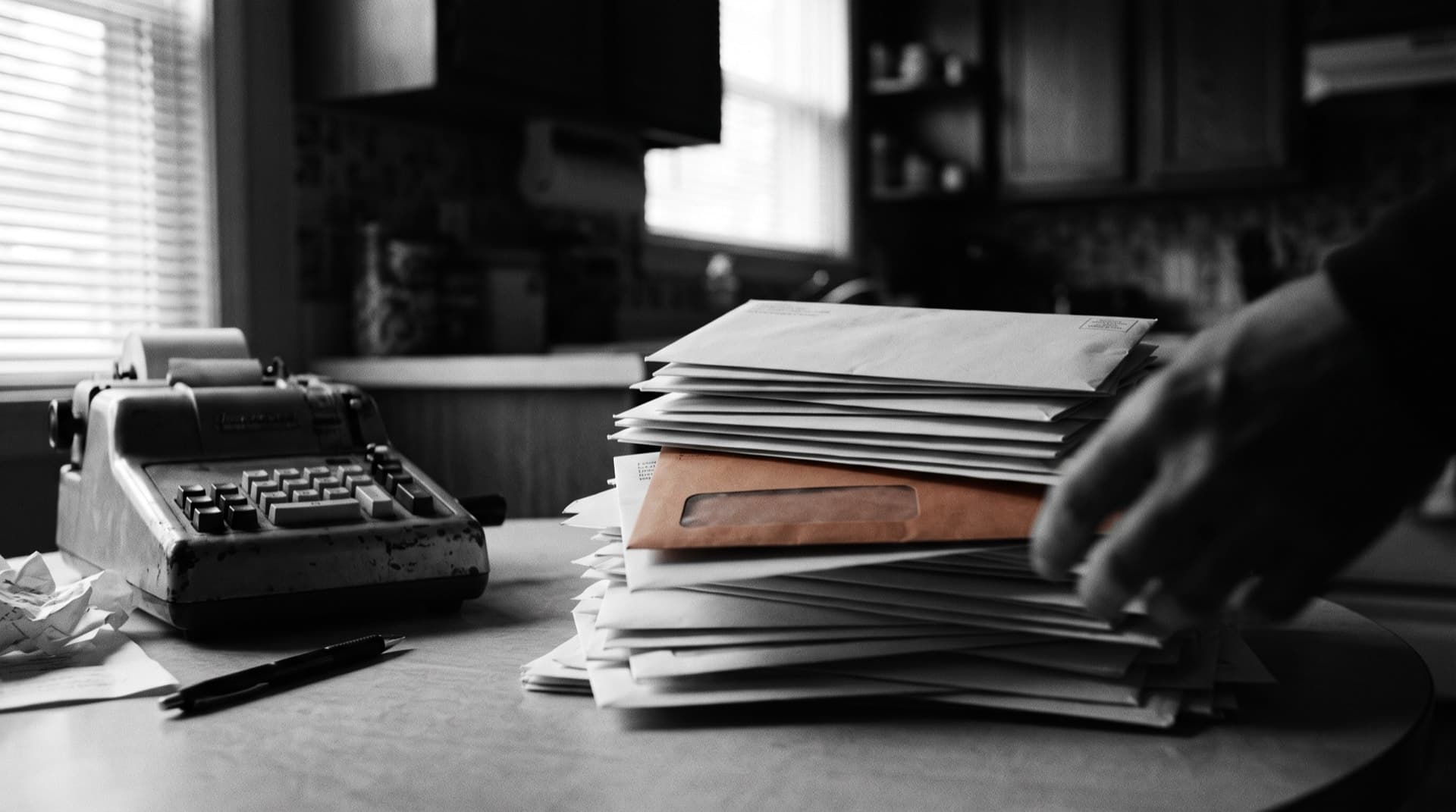 Bills and an adding machine on a kitchen table (photo illustration)